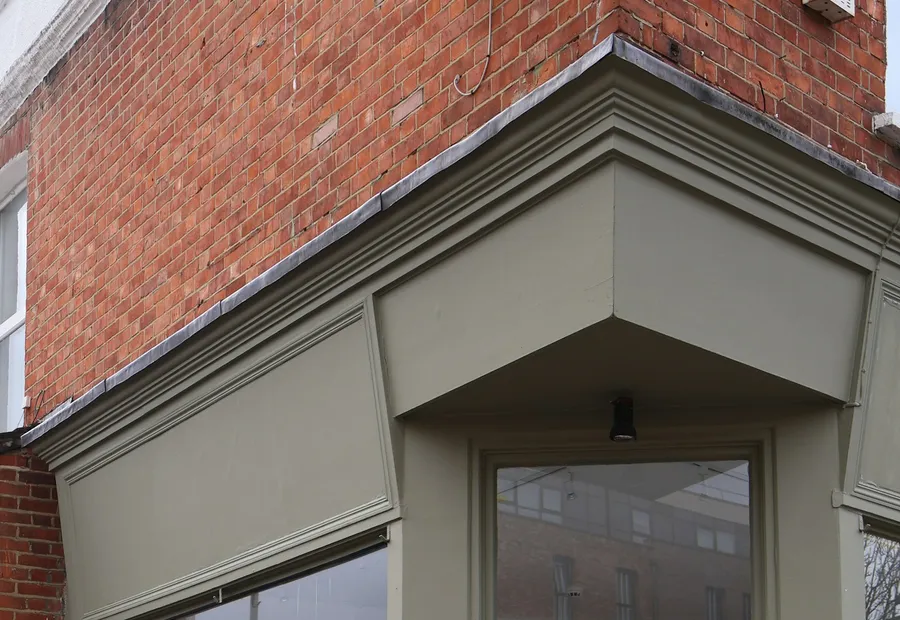 Boarded shop window after temporary securement